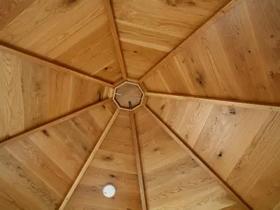 a wooden ceiling with a circle in the middle at The Observatory Tower in Falmouth