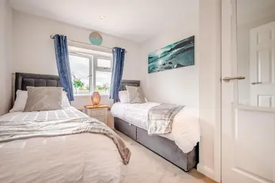 a bedroom with two beds and a window at 2 Bed in St. Merryn oc-a30663 in St Merryn