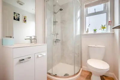 a bathroom with a shower and a toilet and a sink at 2 Bed in St. Merryn oc-a30663 in St Merryn
