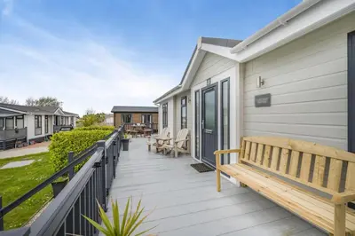 a wooden deck with a bench on a house at 2 Bed in St. Merryn oc-a30663 in St Merryn