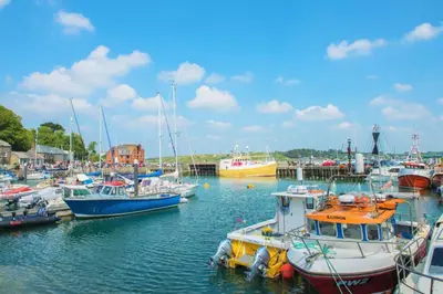 a group of boats are docked in a harbor at 2 Bed in St. Merryn oc-a30663 in St Merryn