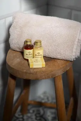 two jars of honey sitting on top of a wooden table at Stylish cottage, log burner - Tregavone Cottage in Falmouth