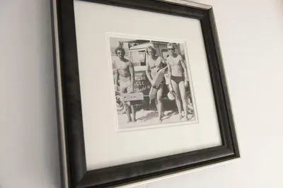 a framed picture of three girls in a bathroom at Olive Cottage, Carbis Bay - Parking Nearby, Free WiFi, Coffee Machine - Couples Retreat in Carbis Bay