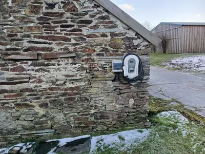 a stone wall with a toilet on the side of it at The Dairy Barn in Camelford