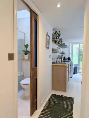 a bathroom with a toilet and a sink at Ramble & Rye - The Nest in Talland