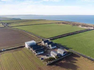 an aerial view of a building in the middle of a field at 3 Bed in St. Eval oc-k30666 in Saint Eval