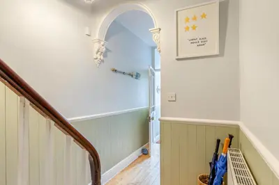 a hallway with a staircase with an archway in a house at 3 Bed in St. Ives oc-c30654 in St Ives