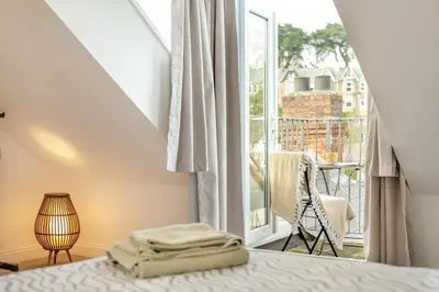 a bedroom with a bed and a large window at 3 Bed in St. Ives oc-s30653 in St Ives