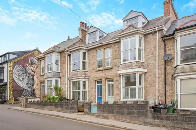 a building with a mural on the side of it at 3 Bed in St. Ives oc-s30653 in St Ives
