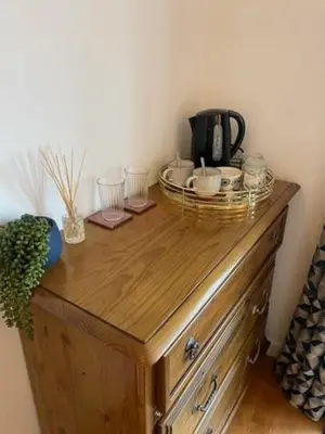 a wooden cabinet with a coffee maker on top of it at Valley View in Port Isaac