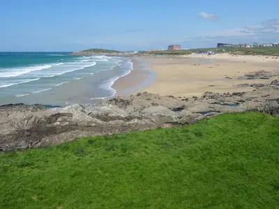 a view of a beach with rocks and the ocean at Beachside Fistral, Newquay in Newquay