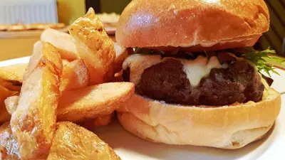 a meatball sandwich and french fries on a plate at Jacobs Ladder Inn & Brewery in Falmouth