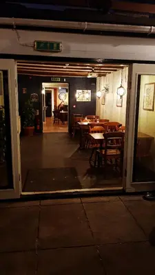 a view of a dining room from the window of a restaurant at Jacobs Ladder Inn & Brewery in Falmouth