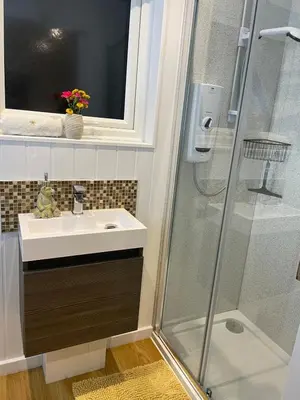 a bathroom with a sink and a shower at Hillview Haven in Liskeard