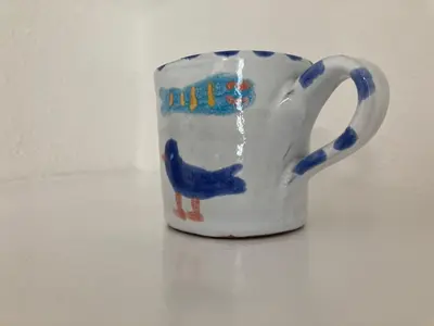 a blue and white cup with a blue bird on it at flat with Cornish charm, parking and garden in St Ives