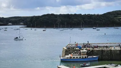 a group of boats in a large body of water at Potted Shrimp in Saint Mawes