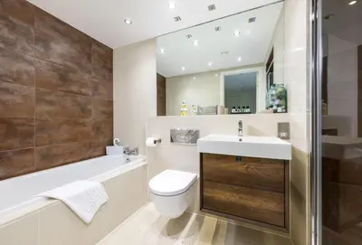 a bathroom with a sink and a toilet and a bath tub at 25 Rocklands in Newquay in Newquay