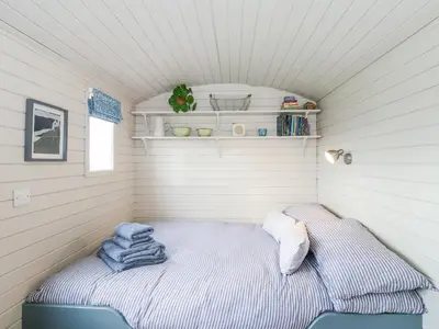 a small room with a bed in a house at Teg in Helston