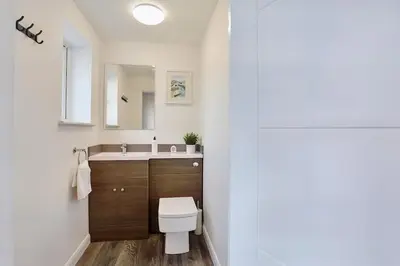 a bathroom with a toilet and a sink at 2022 Modern Home In Central Hayle With Parking & EV plug in Hayle