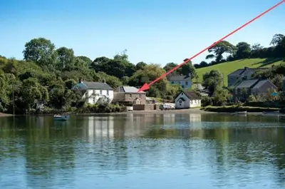 a large body of water with houses and a town at Riverside in Kea