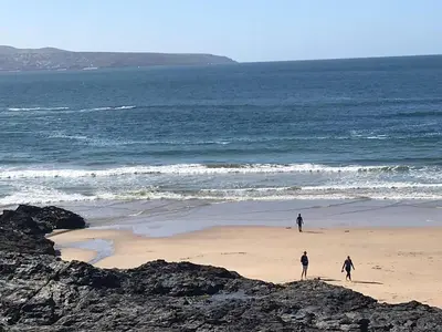 a group of people walking on the beach at Lovely Shepherds hut near St Ives Cornwall in Gwinear Road Station