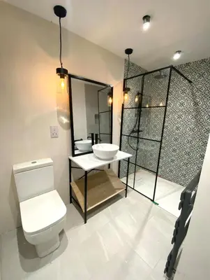 a bathroom with a toilet and a sink at Elisa Villa - tranquil retreat 5 mins from the sea in Port Isaac