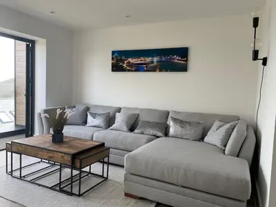 a living room with a couch and a coffee table at Perpetual House St Ives Cornwall in St Ives