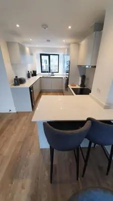 a kitchen with a table and two chairs at Perpetual House St Ives Cornwall in St Ives