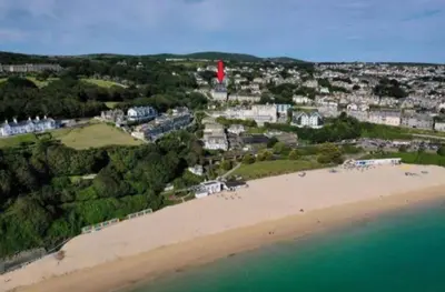 an aerial view of a beach with a town in the background at Perpetual House St Ives Cornwall in St Ives