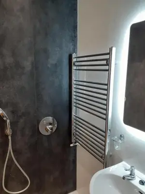 a bathroom with a shower and a sink at Maypole Cottages - No 12 Broad Street in Padstow
