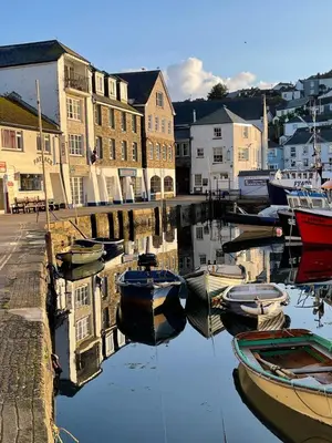 a group of boats are docked in a harbor at Cosy Cottage, Mevagissey in Mevagissey
