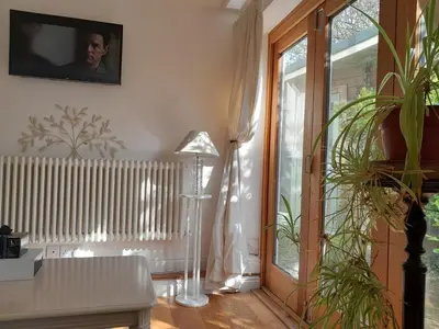 a living room with a table and a plant at Trelean Lodge in Leedstown