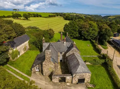 an aerial view of an old house in the countryside at Levalsa House in Pentewan
