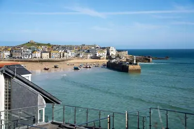 a view of a beach with houses and the ocean at Bijou in St Ives