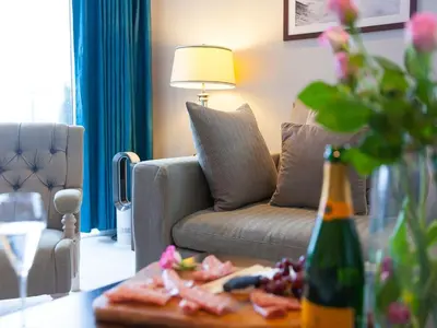 a living room with a couch and a table at Wingspan in St Ives