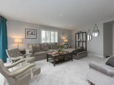 a living room with a couch and a table at Wingspan in St Ives