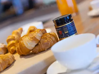a table with croissants and a jar of peanut butter and croissant at Wingspan in St Ives
