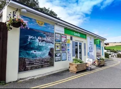 a building with a large mural on the side of it at 151 Newquay Bay Resort in Porth