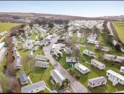 an aerial view of a trailer park with parked vehicles at 151 Newquay Bay Resort in Porth