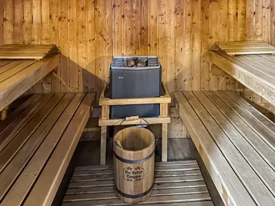 a inside of a wooden cabin with a barrel in it at Culver Cottage - Uk48987 in Looe