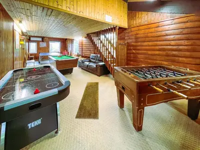a living room with a pool table and a ping pongetitive at Linney Cottage - Uk48986 in Looe