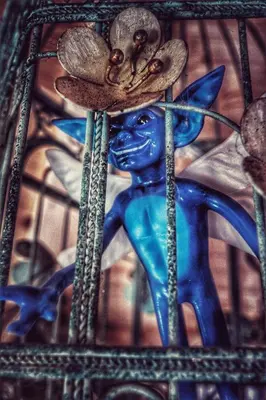 a blue figurine with a hat and a flower at The Wizards Cauldron -Harry Potter Themed in Lewannick