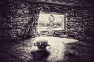 a coffee cup sitting on a table in a room at The Wizards Cauldron -Harry Potter Themed in Lewannick