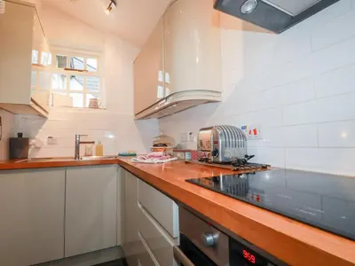 a kitchen with a sink and a counter top at 2 Rose Cottage in St. Agnes