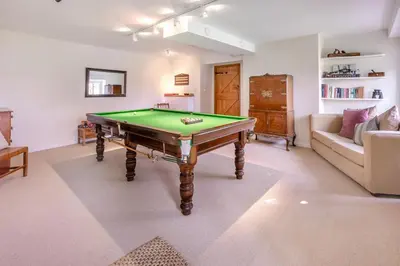 a living room with a pool table and a couch at 3 Bed in Gwennap oc-g30876 in Gwennap