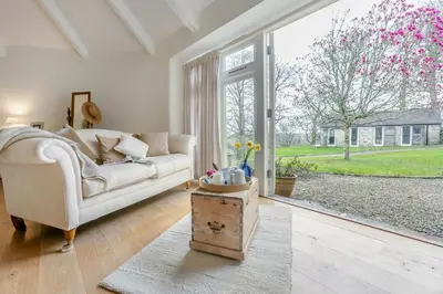 a living room with a couch and a large window at 3 Bed in Gwennap oc-g30876 in Gwennap