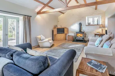 a living room with two couches and a fireplace at 3 Bed in Gwennap oc-g30876 in Gwennap