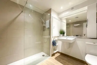 a bathroom with a shower and a sink and a toilet at 2 Bed in Little Petherick oc-o30788 in Little Petherick