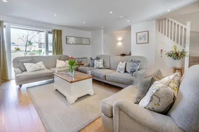 a living room with two couches and a table at 4 Bed in Lelant oc-a30881 in Carbis Bay