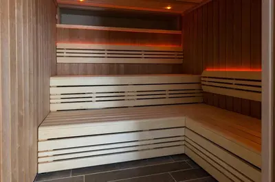 a sauna with wooden benches in a room at 4 Bed in Lelant oc-a30881 in Carbis Bay